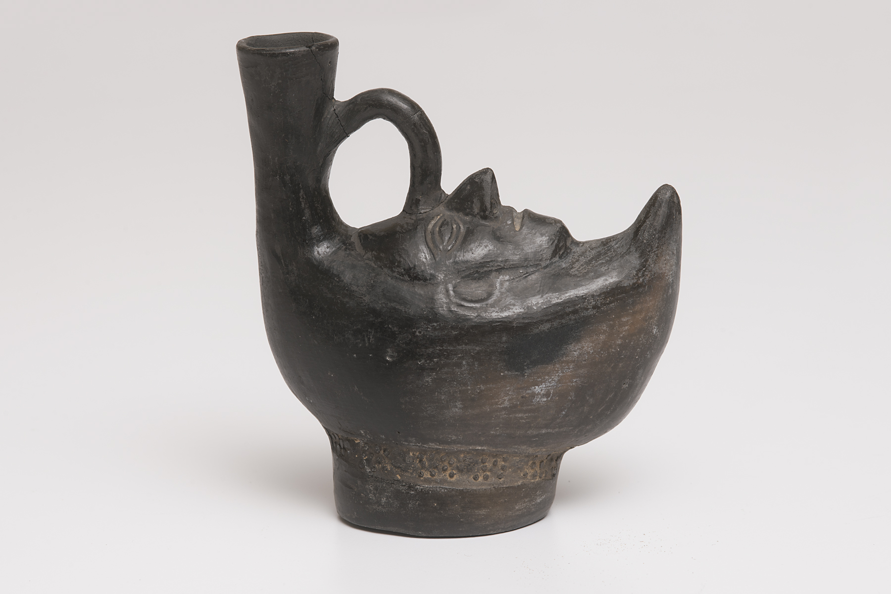 boat-shaped, spouted vessel with a human face, unrecorded Chimú artist